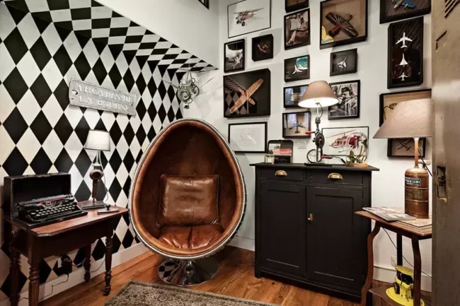 Photographe immobilier ROUEN salon vintage fauteuil coquille décoration cadres